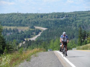 Rich cycling uphill in Nova Scotia