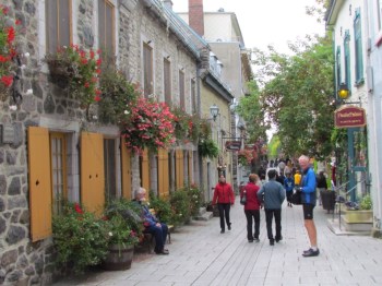 Rich pauses on a narrow street