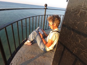 Reading on the lighthouse catwalk