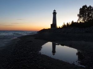 Lighthouse sunrise reflection