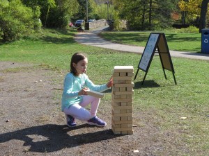 Mya playing Jenga in Pop Up Park
